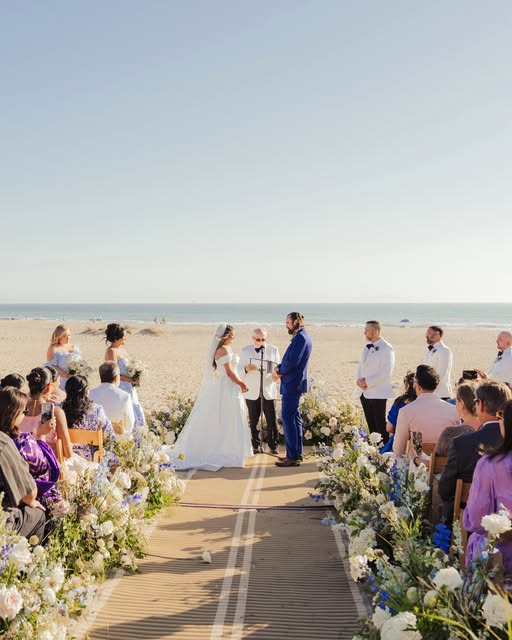An outdoor wedding ceremony beside the ocean